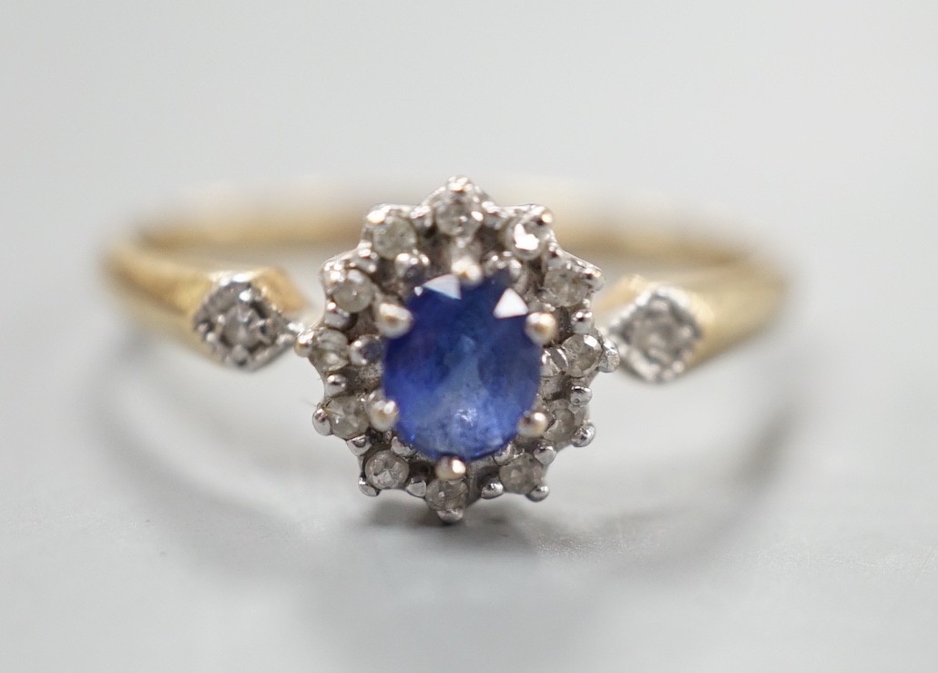 A modern 9ct gold, sapphire and diamond set cluster ring, size R, gross 2.3 grams.